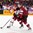 COLOGNE, GERMANY - MAY 6: Latvia's Ronalds Kenins #91 and Denmark's Jesper B. Jensen #41 battle for the loose puck during preliminary round action at the 2017 IIHF Ice Hockey World Championship. (Photo by Andre Ringuette/HHOF-IIHF Images)

